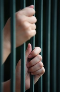 jail - hands holding bars