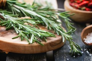 Herbs Fresh from the Garden rosemary on a cutting board
