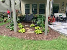 deck and swing Example photograph of a completed DIY landscape project